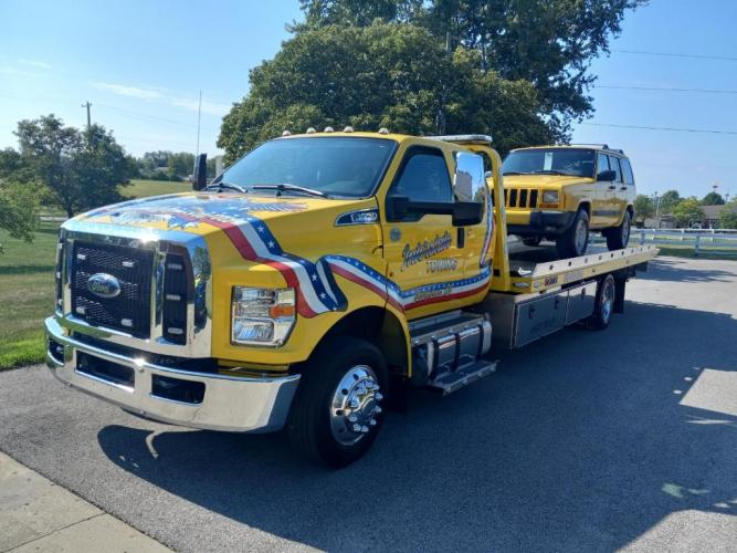 towing yellow jeep
